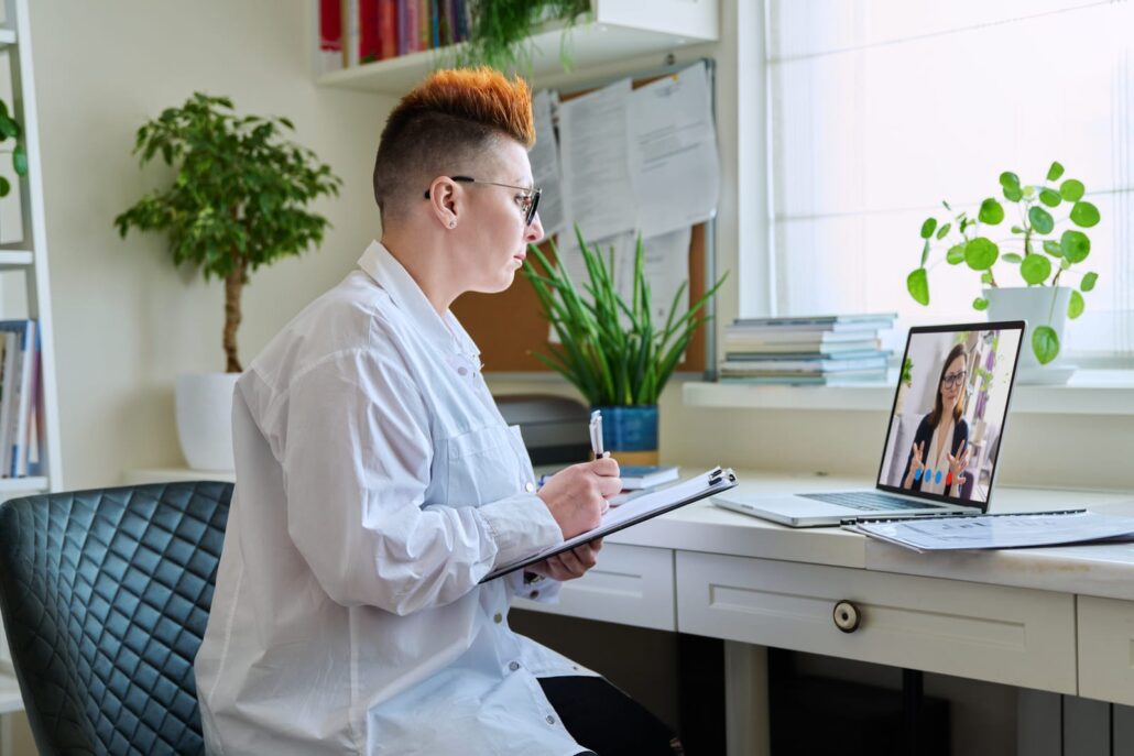 58937952 female psychologist having online therapy with middle aged woman patient